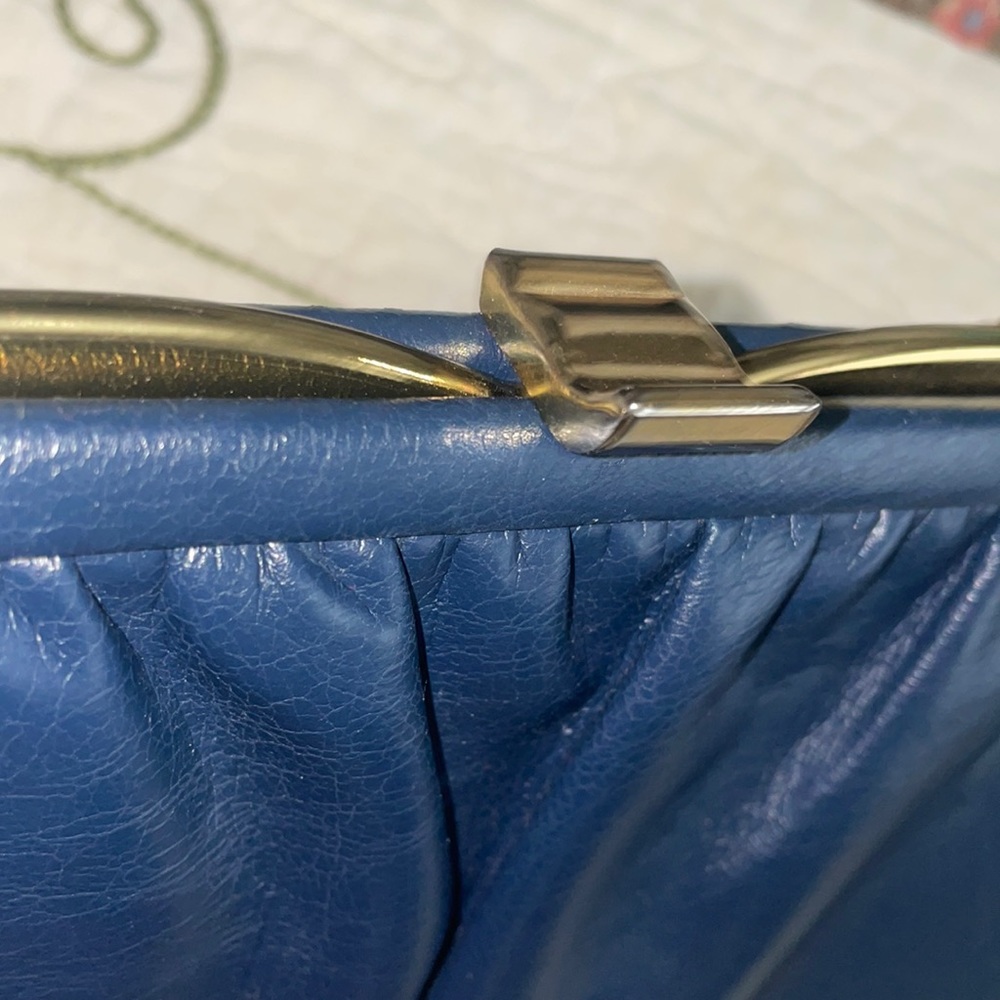 Vintage navy purse measures 10 inches width (bottom) and 6.5 inches in length
